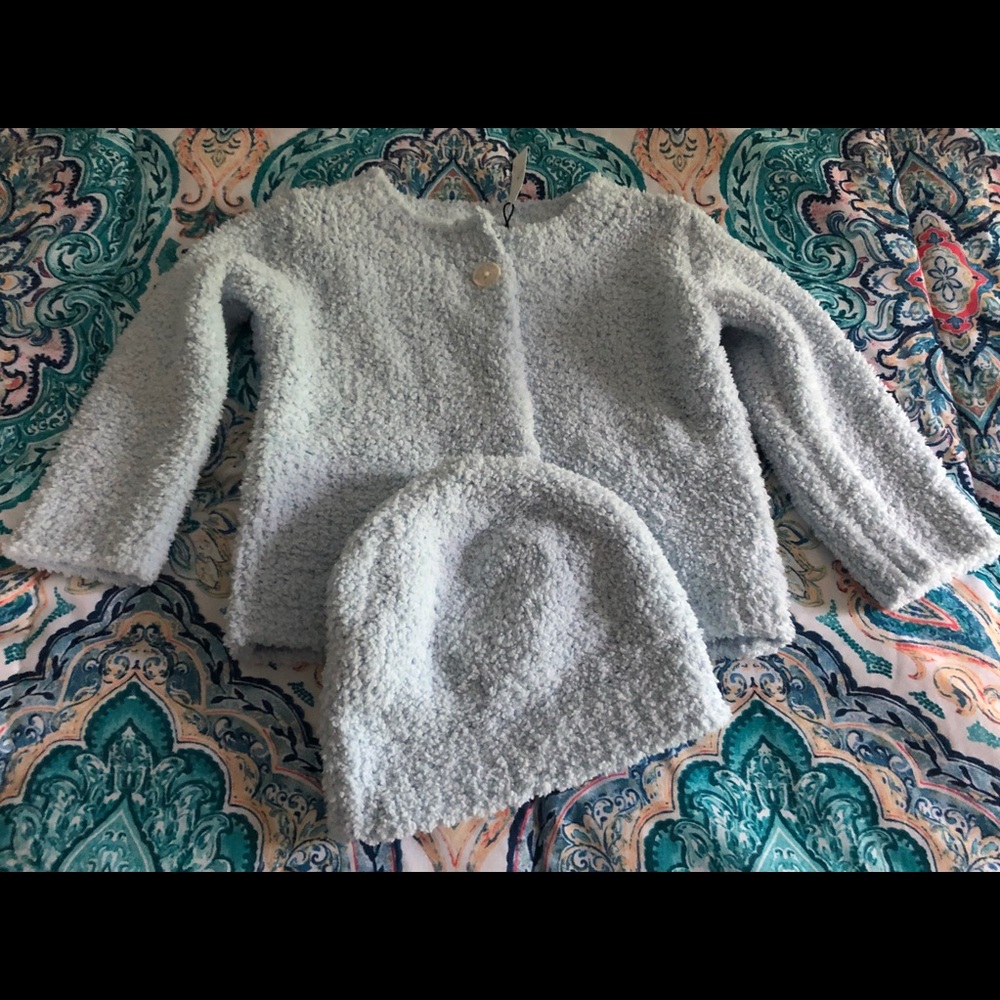 Precious light blue sweater and hat. 💙